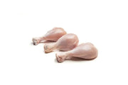 A pack of five fresh skinless chicken drumsticks on a white background.